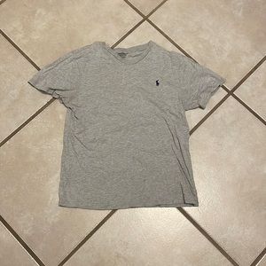Grey polo with small hole